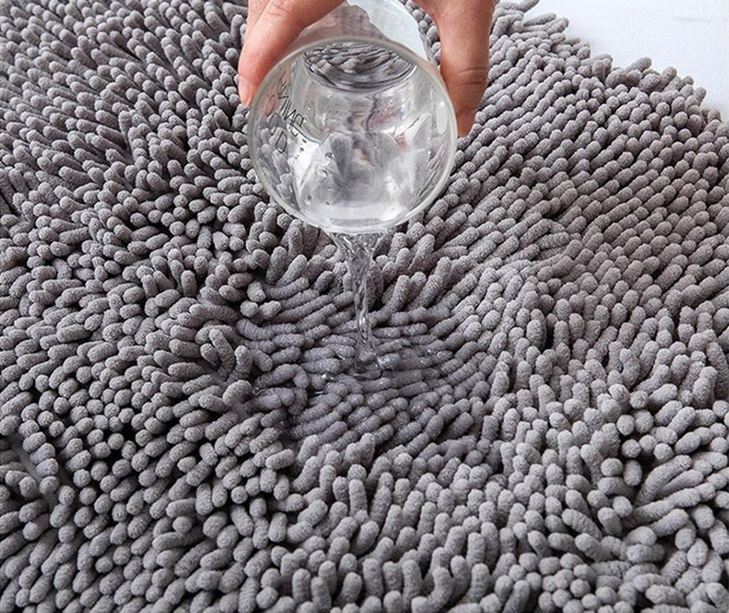 Water poured onto the chenille mat soaking straight in
