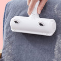 Reusable pet hair roller lifting fur off a grey couch
