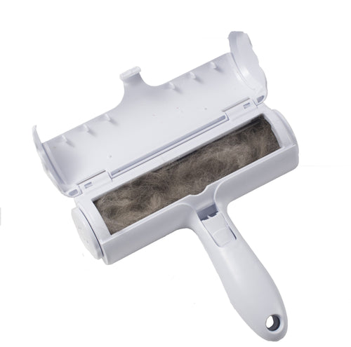 Pet hair roller opened to show collected hair in the waste compartment